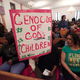 A woman holds a sign at a prayer service in Flint, Mich., before participating in a national mile-long march to highlight the push for clean water in Flint on Feb. 19, 2016. (Bill Pugliano/Getty Images)